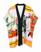 Tunique kimono courte EMAMOTTO PARIS en tissu fluide avec imprimé floral coloré et bordures noires contrastées